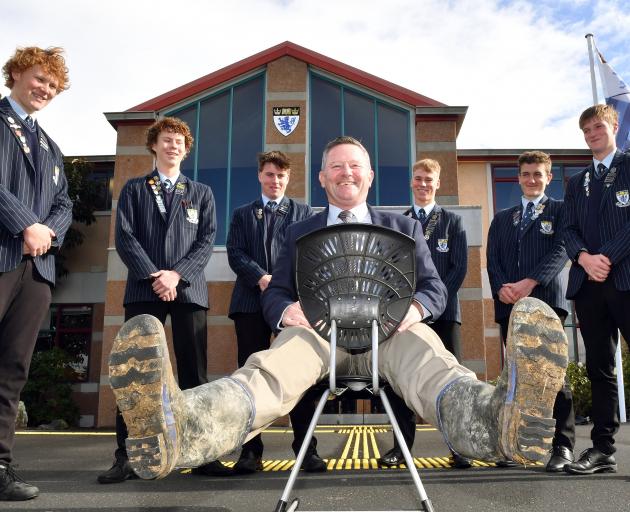 Mucking in . . . King’s High School rector Nick McIvor has his boots ready to support about 50 of...