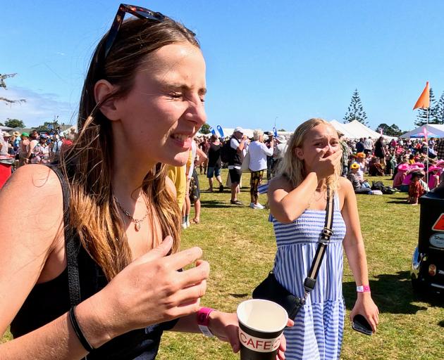 A punter tries to hold down her lunch at the Hokitika Wildfoods Festival. Photo: Geoff Sloan