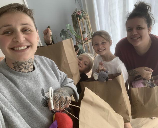 Mickenzi Askin with daughters Madeline, 5, Scarlett, 8, and her friend Amber Braxton. PHOTO:...
