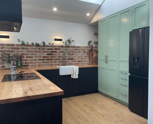 Steadfast Joinery made the bench top from the home’s old wall timbers and Builders Connor Jones...