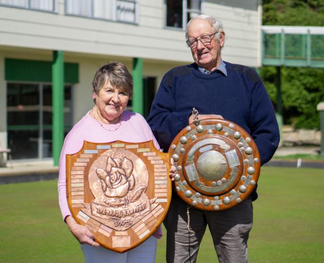 Alison and Neville Ludemann hold up the Rose Ranfurly and Mills Shield at the Maheno Bowing Club...