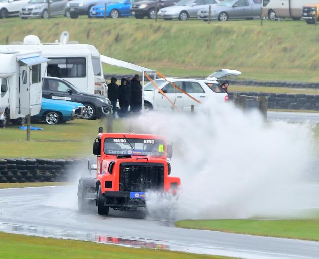 Marc King, of Eketahuna, treats his International Custom to a clean during a NZ Supertruck race...
