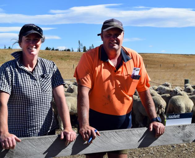 Farm owner Cassie Becker and block manager Hamish Wade in a pen of halfbred wether lambs at their...