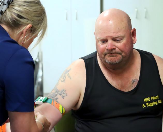 Phlebotomy team leader Jane Walker takes a blood sample from Mark Sims, of March Construction....