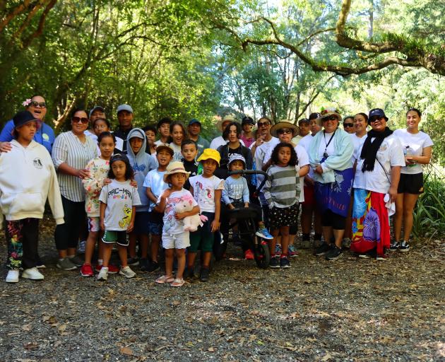 Members of the local Tuvalu community gather to take part in a walk along the Upper Ross Creek...