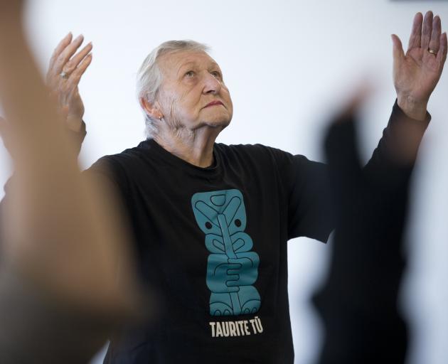 Ellen Patrick gives thanks to Rakinui the sky father while warming up at the beginning of the class.