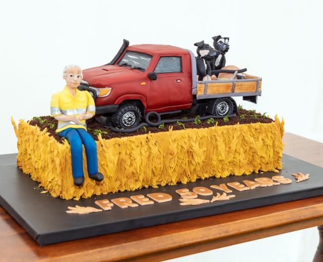 A cake depicting Mr Goodall’s two canine companions, Bob and Buster and his trusty ute was the...