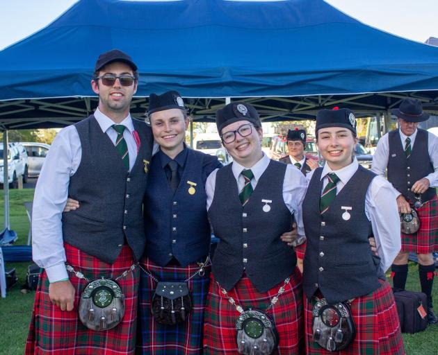 Enjoying the pipe band nationals were (from left) pipe major William McArthur with drummers...