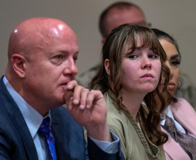 Hannah Gutierrez-Reed (centre) with attorney Jason Bowles and paralegal Carmella Sisneros. Photo:...