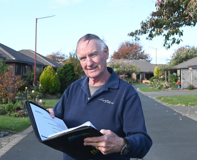 Retirement Villages Residents Association national president Brian Peat looks over documents at...