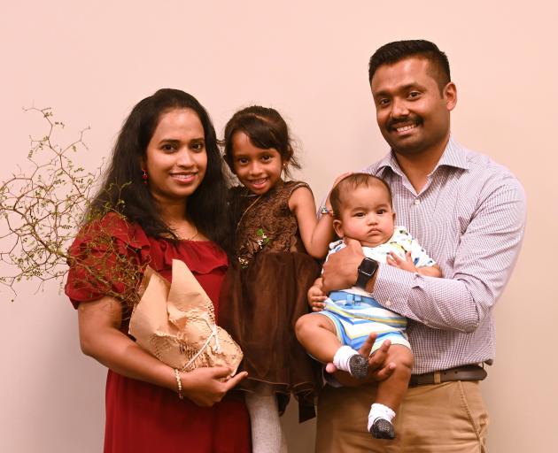 Celebrating their parents (from left) Dhanya Mathew and Jiss Thomas, of India, becoming New...