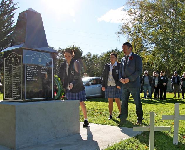 Placing the first wreath on Beaumont’s new memorial monument are  Lawrence Area School pupils...