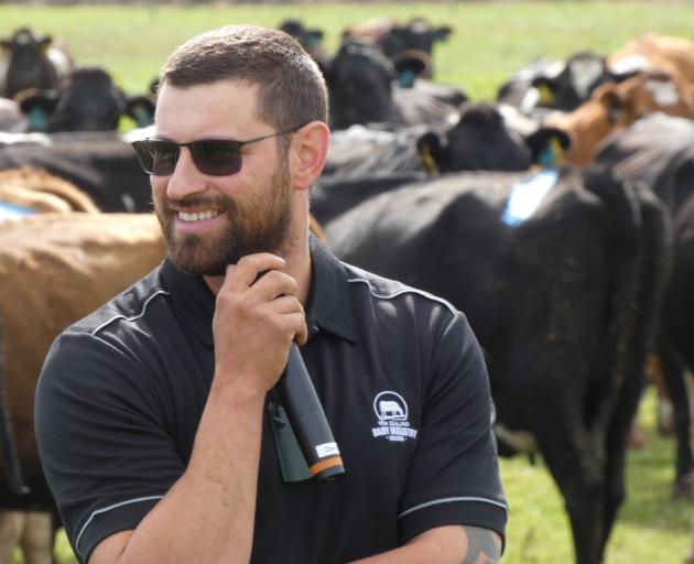 Southbridge contract milker Alan Robson da Veiga talks to farmers about his plans at a field day...