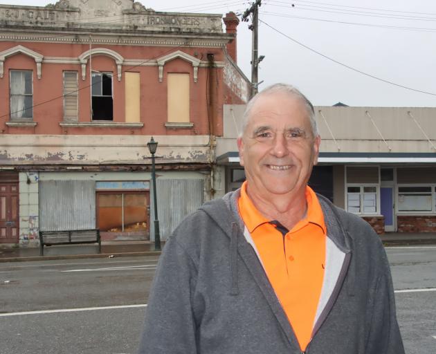 Living Well Mataura Church pastor Mike Whale stands in front of the Galt building and the...