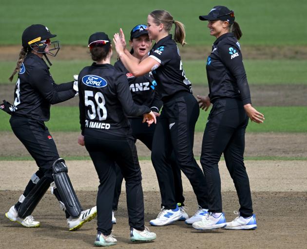 New Zealand celebrate a wicket in the third ODI against England at Seddon Park in Hamilton. Photo...