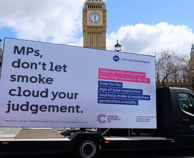 A billboard from Cancer Research UK ahead of the vote in London. Photo: Getty Images