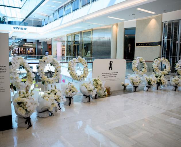 A floral memorial is seen for the victims who lost their lives in a knife attack at Westfield...