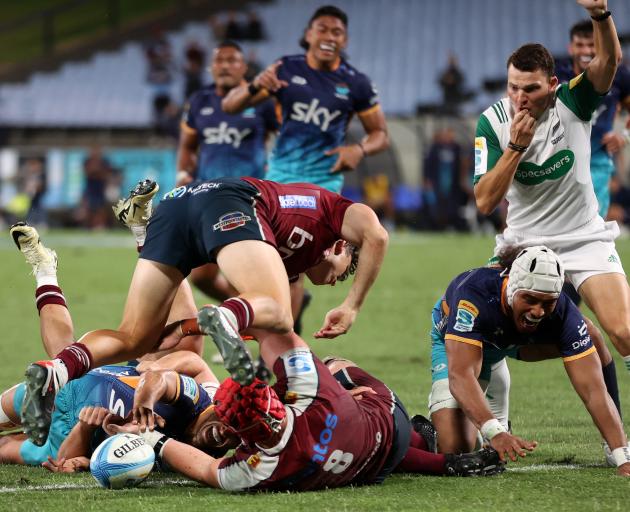 Moana Pasifika celebrate a try against the Reds in Whangārei. Photo: Getty Images