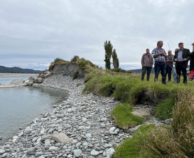 West Coast Regional Council staff and elected officials viewing a hole in the Wanganui River...
