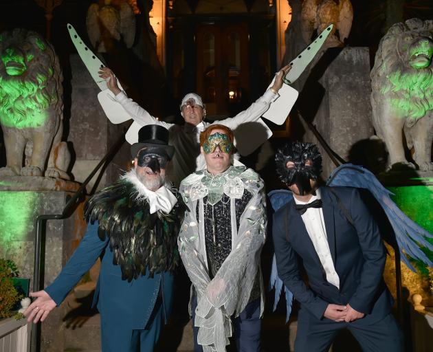 Strutting their stuff outside Larnach Castle are Wild Dunedin Masquerade Ball organisers (front,...