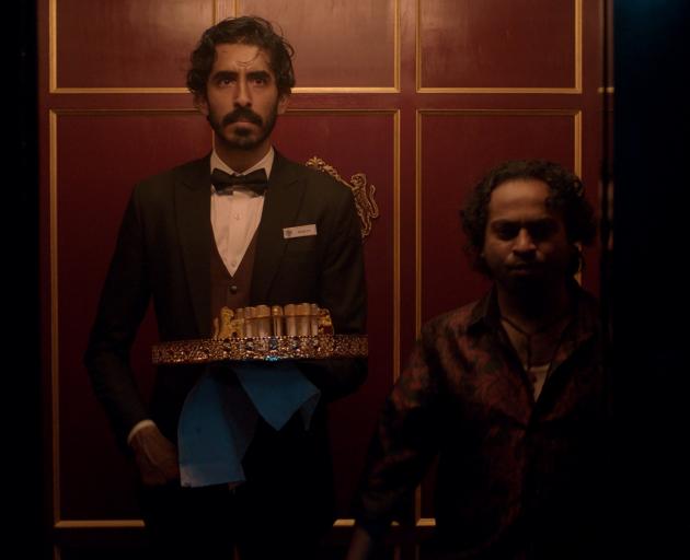 From left, Dev Patel is Kid and Pitobash is Alphonso in "Monkey Man", directed by Dev Patel....