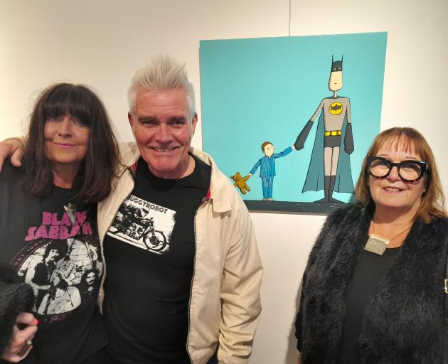 Oamaru-based artist Martin Horspool stands by his artwork with Wendy (left) and Judith Jones at...