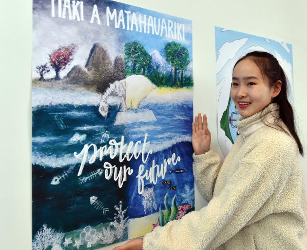 The Great Kiwi Poster Competition 2023 intermediate winner Danielle Wu  shows her poster at...