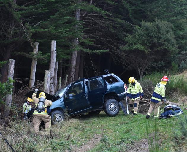 Fire and Emergency New Zealand (Fenz) crews respond to a single-vehicle crash in Blueskin Rd,...