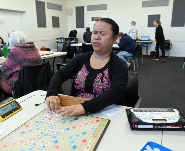 Olivia En takes part in a National Scrabble Day tournament in South Dunedin on Sunday. PHOTO:...