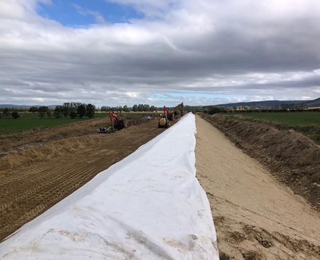 Another view of the work being done on the contour channel flood banks.
