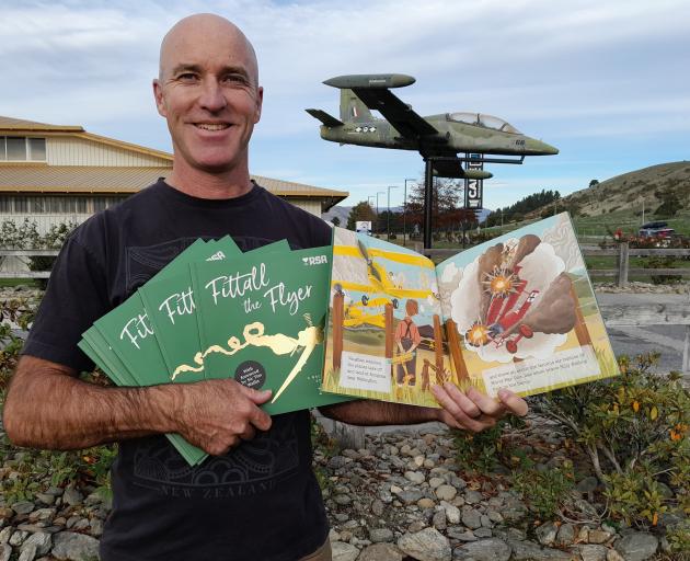 Wānaka writer Toby Butland with his second children's book, Fittall the Flyer, which is a...