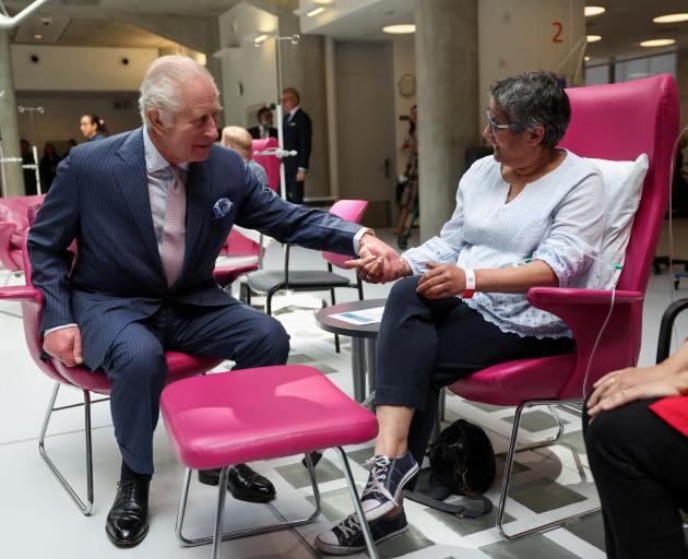 King Charles talks with patient Asha Millan during a visit to the University College Hospital...