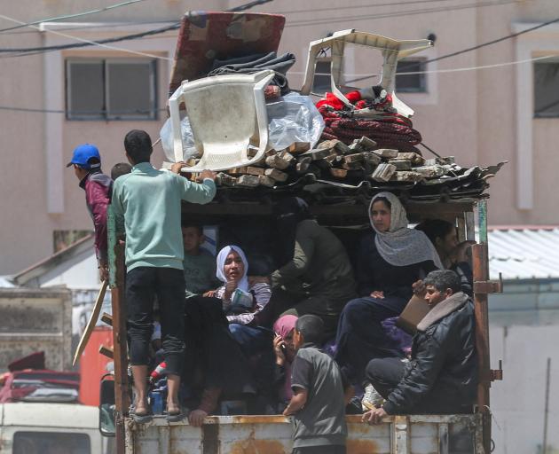 People flee the eastern parts of Rafah  on Monday. Photo: Reuters 