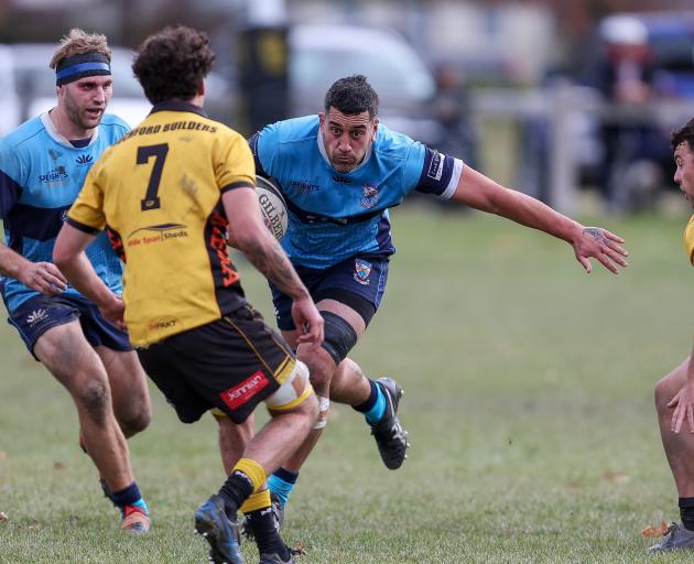 Raf Tuhura prepares to swerve past an Upper Clutha defender. PHOTO: SUPPLIED