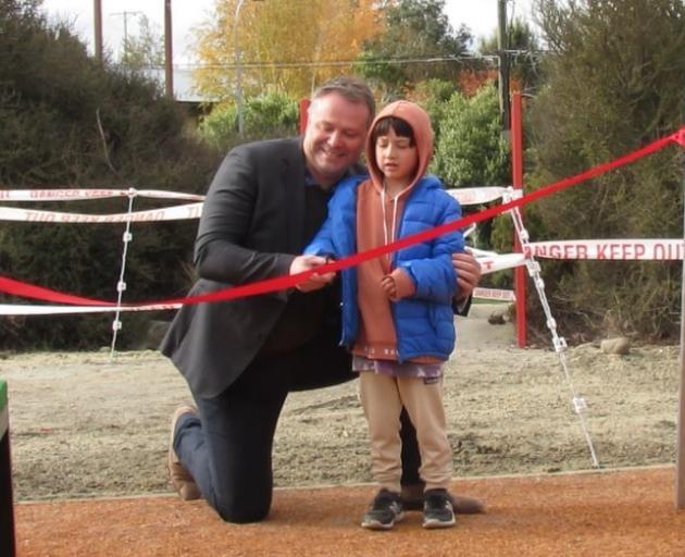 Cutting the ribbon at the Hopkins St playground reopening in Luggate on Sunday are Queenstown...
