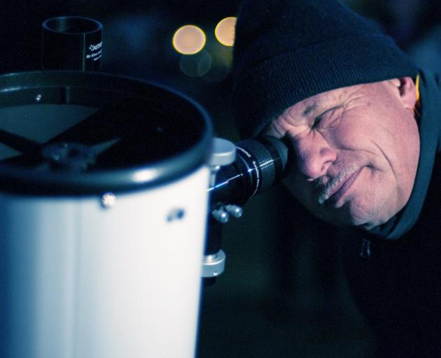 Dunedin astronomer Nick Simpson looks at star Alpha Crucis through a telescope at Naseby Domain...