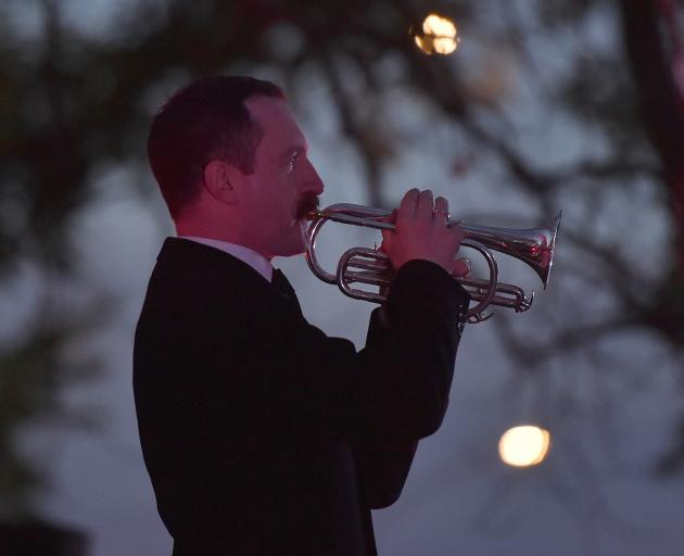 Ralph Miller playing the Last Post during the dawn Anzac service at the cenotaph in Dunedin....