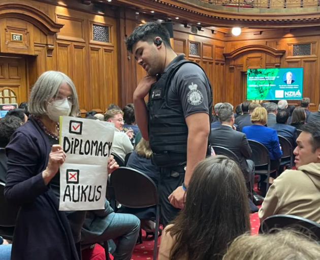 A member of the public protesting against AUKUS disrupted Minister of Foreign Affairs and Trade...