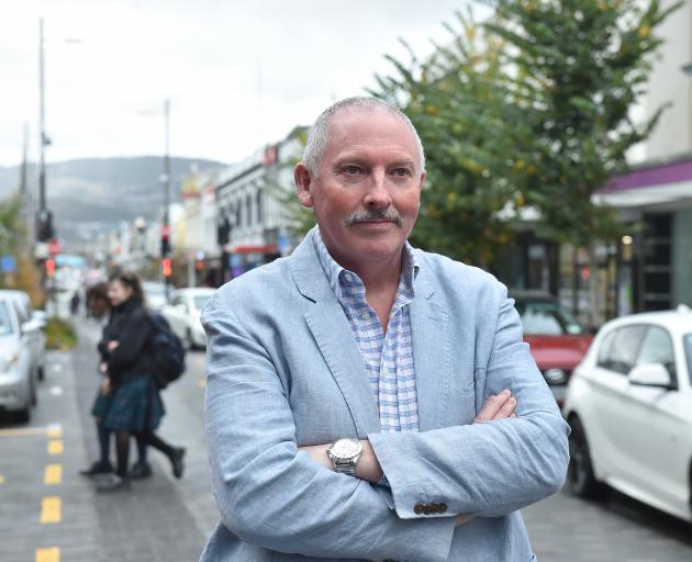Dunedin city councillor Brent Weatherall stands in the Farmers block of George St, following the...