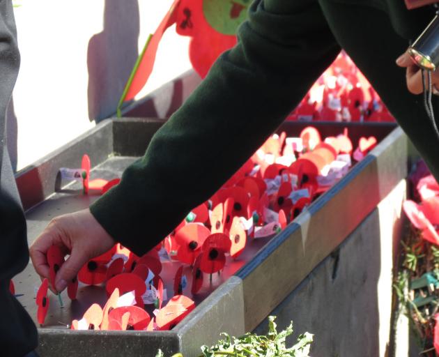 A poppy is placed at the base of the Cromwell Cenotaph following the Anzac service last week....