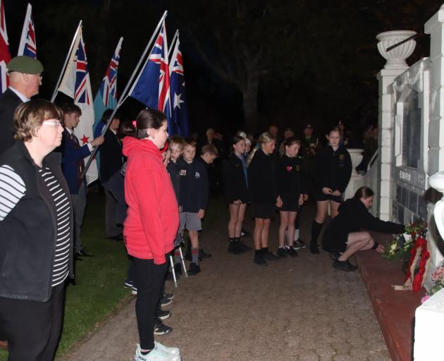 Gore school pupils line up to lay wreaths during the Anzac Day dawn service at the Gore Cenotaph...