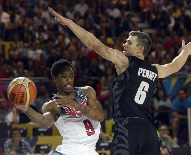 Penney in action for the Tall Blacks against United States forward Demar Derozen during the 2014...