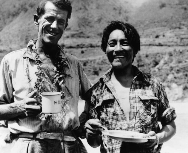 Edmund Hillary and Tenzing Norgay enjoy a snack. Photo: Getty Images