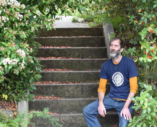 Wakari resident Jeremy Quinn sits on his and his neighbour’s shared staircase that waste from the...