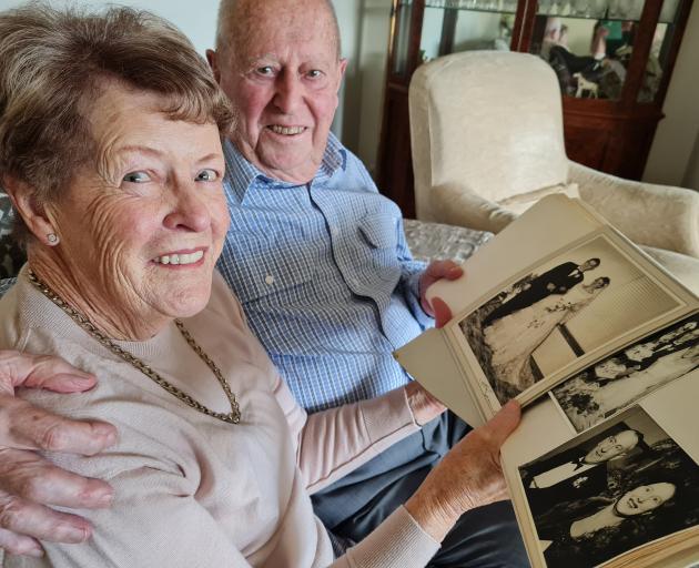 Wānaka retirees Eleanor, 85, and John, 86, Lischner look through photographs from their wedding...