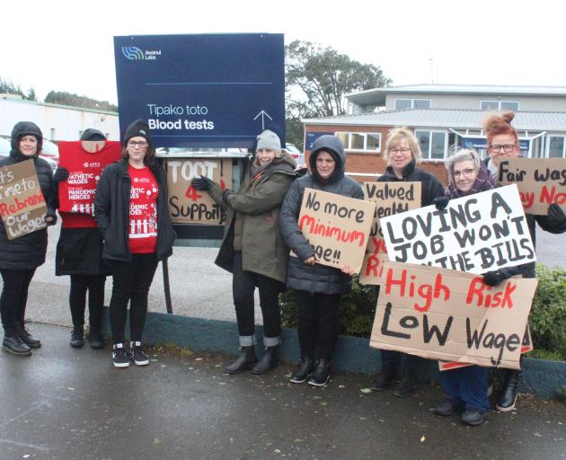 Awanui Laboratory phlebotomists picketed outside their workplace in 2023, seeking fairer pay....