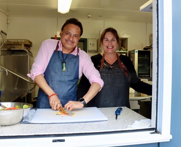 Ronnie Bhogal, left, and Charlotte Dawson serve fresh and tasty food at Silverstream School....