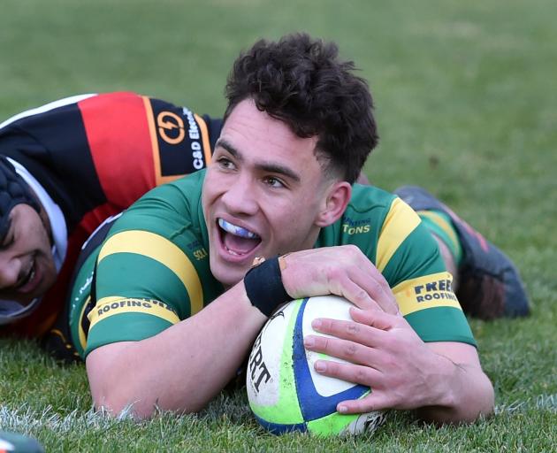 Greenisland first five Caleb Williams gets passed Zingari hooker A-One Lolofie to score a try...