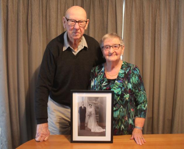 Invercargill couple Doug and Fay Ridder display a wedding photo they managed to get taken at...