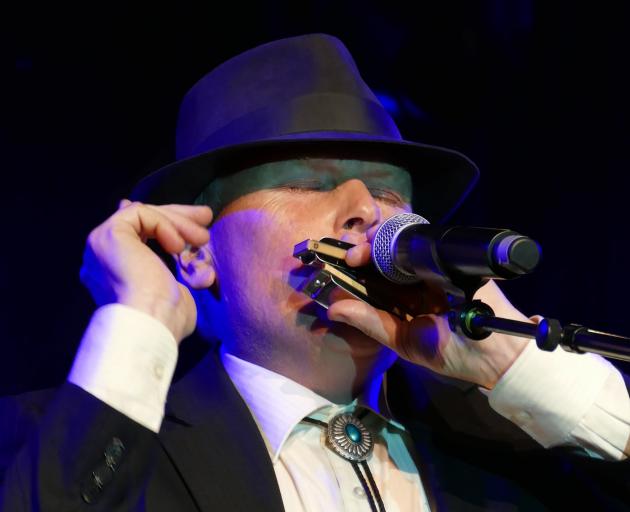 Gore instrumentalist Brendon Fairbairn gees up the crowd with his harmonica during the MLT Gold...